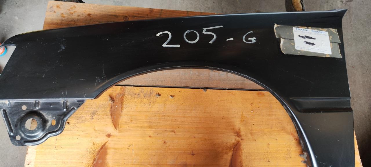 Aile avant gauche Peugeot 205 neuf d'origine LesAnciennes.com