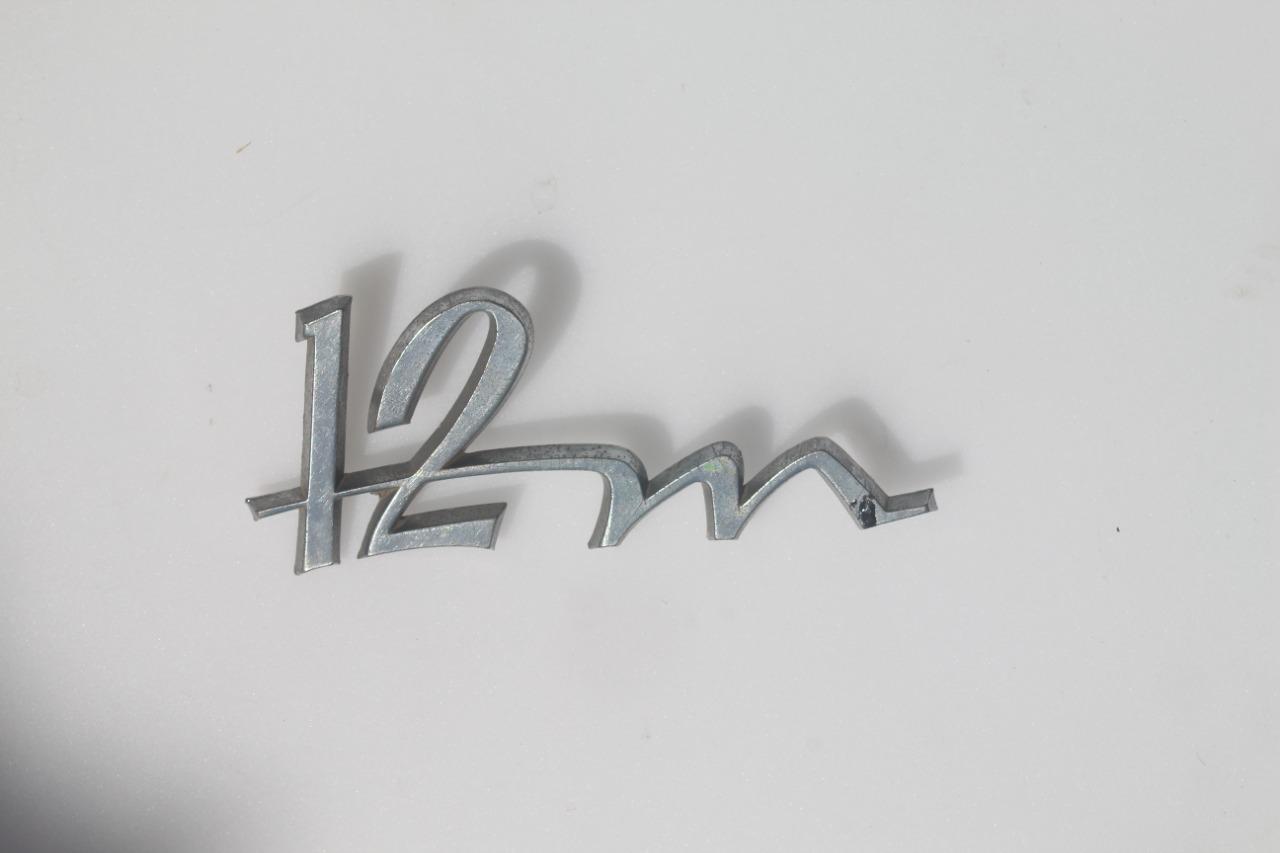 Logo FORD Taunus 12m LesAnciennes.com